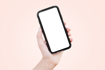 Smartphone in hand with blank on screen. Pastel background. Mockup concept.