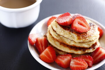 Closeup pancakes with coffee and strawberries food sweet pastry bakery breakfast 