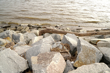 Closeup shot of sea waves touching the rocks on the beach in Dover, Delaware