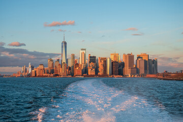 New York City skyline at sunset from New York Harbor featuring the Financial District