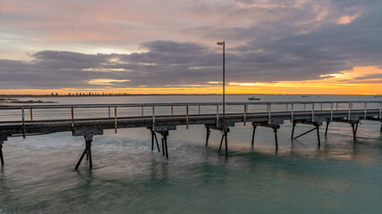 Obraz premium Sunrise over the Beachport Jetty located in the southeast of South Australia taken on February 20th 2022