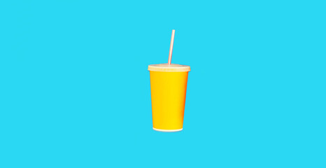 Close up of yellow cup of juice with straw on blue background, top view