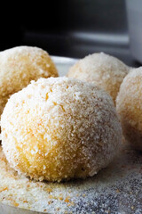 homemade corquettes of pork ham with breadcrumbs flour and egg