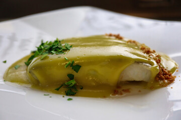 Bakalao slice cooked at with pil pil, garlic and parsley