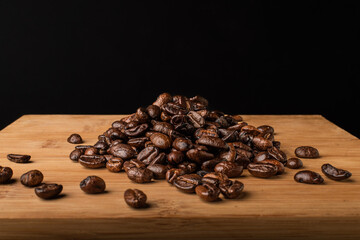 Coffee beans on wooden background
