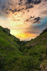 Bright sunset over the mountain landscape in Valles Pasiegos, Cantabria, Spain