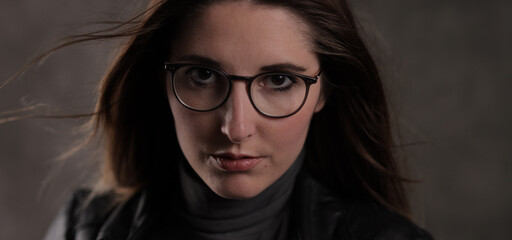 Close-up shot of a young attractive woman in her mid 20s - studio photography