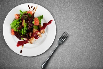 Roast rib steak, fried beef meat on a plate with salad.