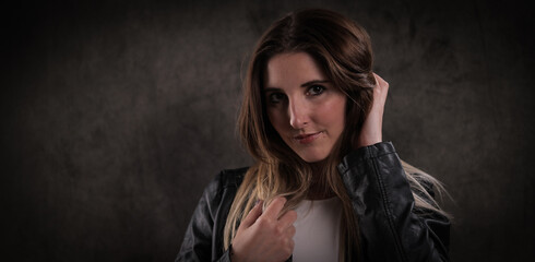 Close-up shot of a young attractive woman in her mid 20s - studio photography