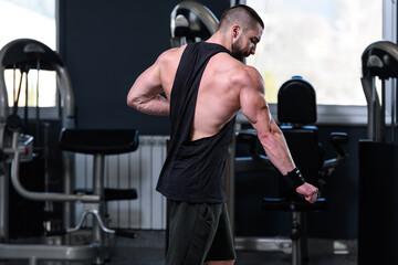 Serious Bodybuilder Standing In The Gym