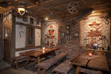 A hotel bar with old fashioned retro styled rooms, and rustic objects.