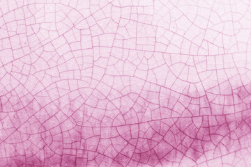 Pink and white crack ceramic tile.  Winter color of glazed tile texture abstract background.