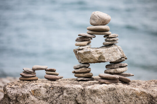 Stones piled up with ocean beyond.