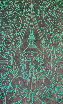 Buddha figure engraved into the Victory Gate at the Royal Palace.