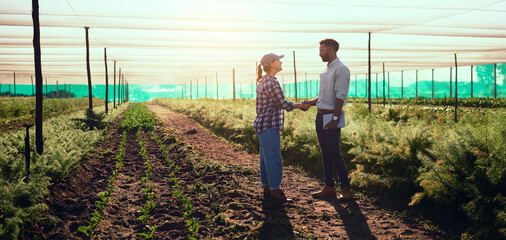 Im leaving the farm in your capable hands. Full length shot of two young farmers shaking hands...