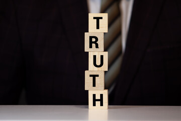 Truth - word from wooden blocks with letters, real facts truth concept, white background
