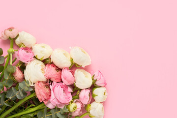 Bunch of ranunculus flowers on a pink background. Mothers Day, Valentines Day, birthday concept