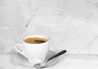 White coffee cup with espresso in morning on  marble desk. Aroma coffee.