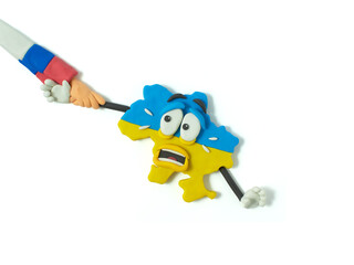 Ukraine map. Cartoon about the conflict in Russia and Ukraine. Peace for Ukraine. ukrainian flag. Stop Ukraine war. Blue and yellow. handmade from plasticine