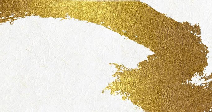 Animation of golden patterns gradually being drawn on white Japanese paper
