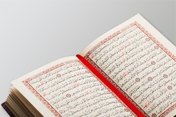 Opened Quran book  for Muslim to recites as a prayers to God.