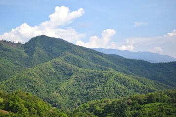 Fototapeta na wymiar Mountain range scenery at road to Doi Sakat, Pua District, Nan Province, THAILAND.