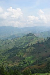 Fototapeta premium Scenery view of mountain range and cloud from Doi Sakat, Pua District, Nan Province, THAILAND.