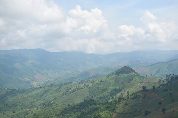 Fototapeta premium Scenery view of mountain range and cloud from Doi Sakat, Pua District, Nan Province, THAILAND.