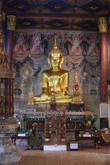 Golden Buddha image inside the main chapel of Nong Bua temple in Nan province, THAILAND.