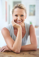 I dont let work stress me out. Cropped portrait of an attractive businesswoman sitting in the office.