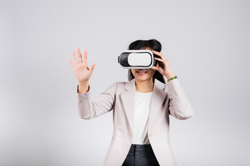 Smiling woman confidence excited wear VR headset device touching air during virtual reality experience isolated white background, Asian happy portrait female playing video game studio shot, copy space