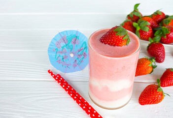 Strawberry yogurt fruit juice smoothie pink colorful fruit juice milkshake blend beverage healthy high protein the taste yummy In glass drink episode morning on white wood background.