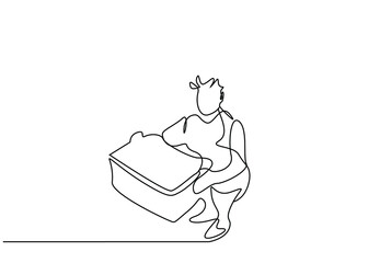 a man working in a factory at a job is holding a large box