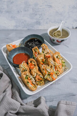 Popular Penang street food. Grilled Thick Walled Tofu Pouch with Bean Sprouts, Cucumber and Spicy Thick Fermented Shrimp Paste.