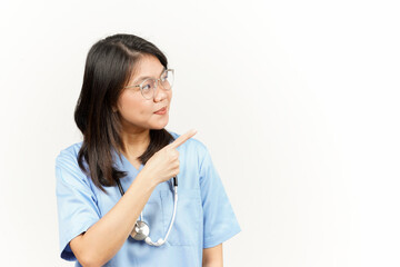 Showing Product and Pointing Side Of Asian Young Doctor Isolated On White Background