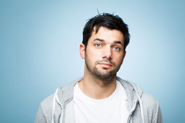 Believe in your cuteness. Shot of a handsome young man against a studio background.