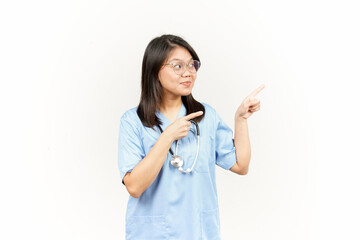 Showing Product and Pointing Side Of Asian Young Doctor Isolated On White Background