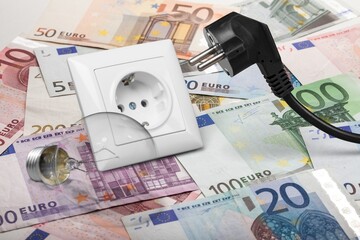 Energy Saving concept. Energy costs and electricity prices. Electricity consumption concept. Euro Banknotes with lamp