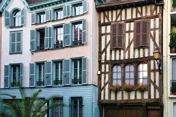 Facades of ancient residential buildings in the old French city of Troyes