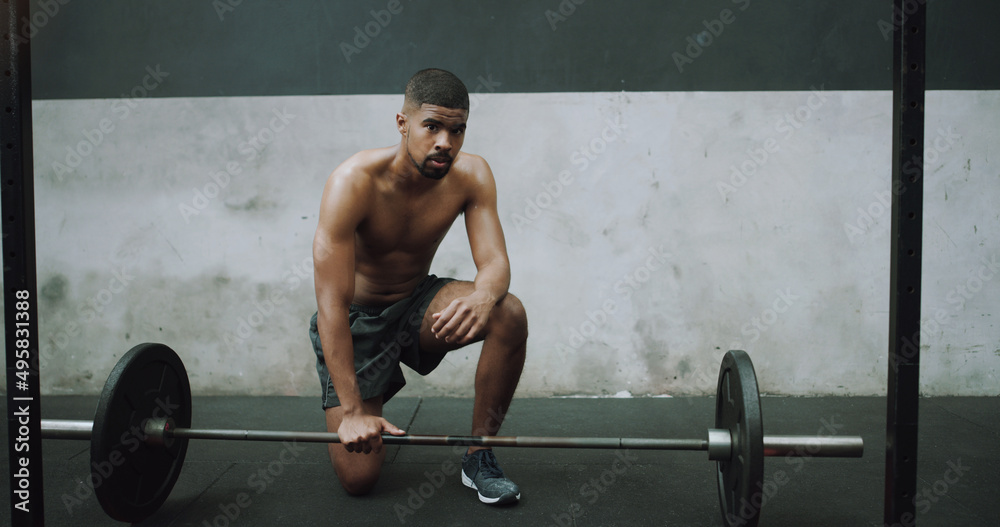 Poster when faced with a challenge, dont run for the exit. portrait of a muscular young man exercising with