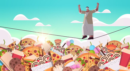 senior woman balancing on rope above junk food assortment of fast food unhealthy nutrition junkfood addiction