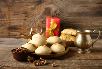 Obraz na płótnie Canvas Tasty Eastern sweets on wooden table
