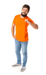 Fototapeta premium Handsome man in bright orange t-shirt on white background
