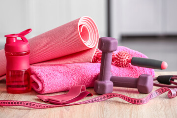 Stylish sport equipment on floor in room