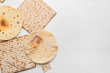 Different Jewish flatbread matza for Passover on white background