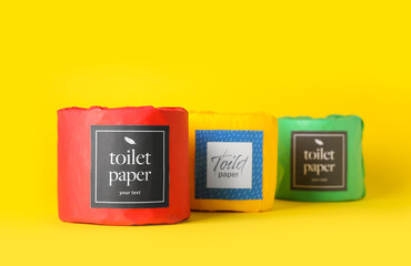 Toilet paper rolls on yellow background