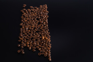 Group coffee beans isolated on black background with reflection. Coffee beans laid out in form.