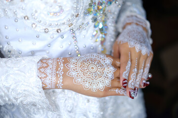 traditional wedding, bridal showing henna design and hand jewellery