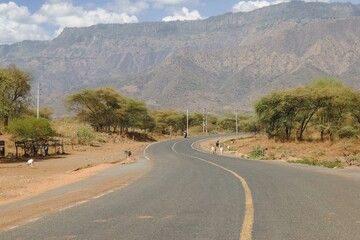 A highway against a mountain background in Baringo County, Kenya