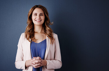 Personal and professional success is my daily motivation. Studio portrait of an attractive and...